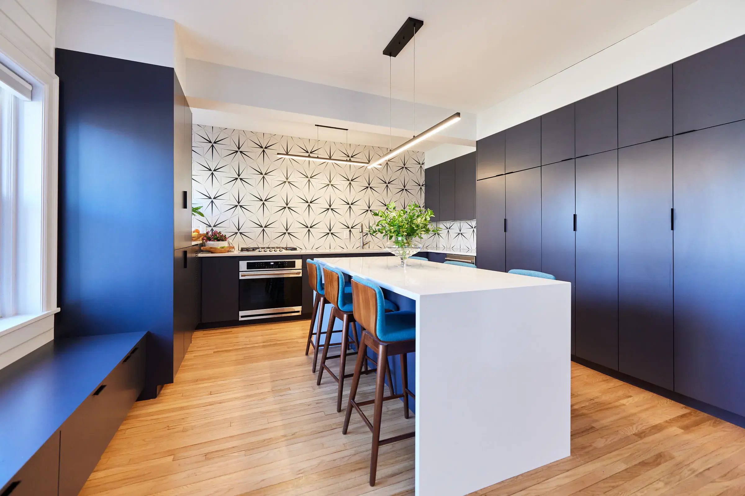 New hardwood flooring installed in a modern apartment kitchen