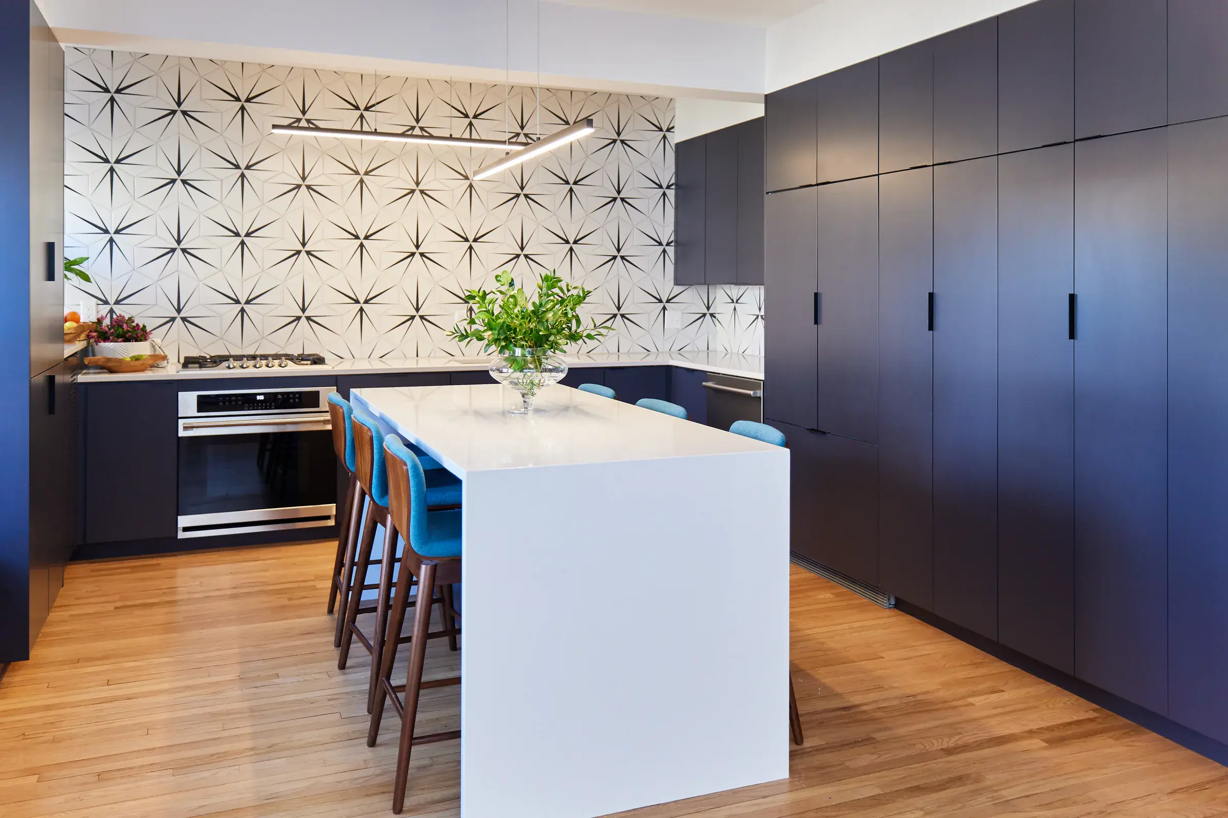 Custom hardwood floors in a modern apartment kitchen