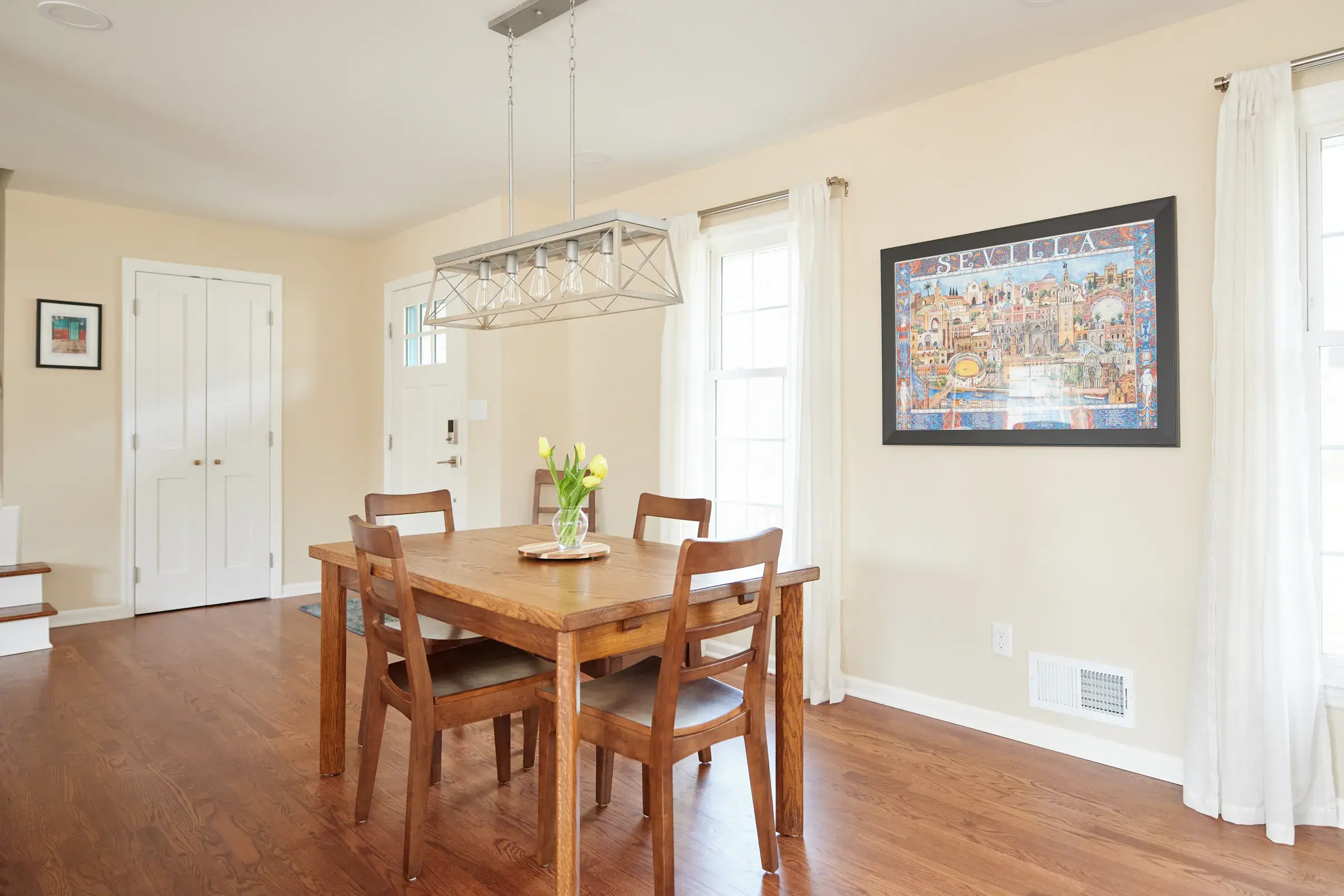 Refinished hardwood floors in the bright Guillen home dining room