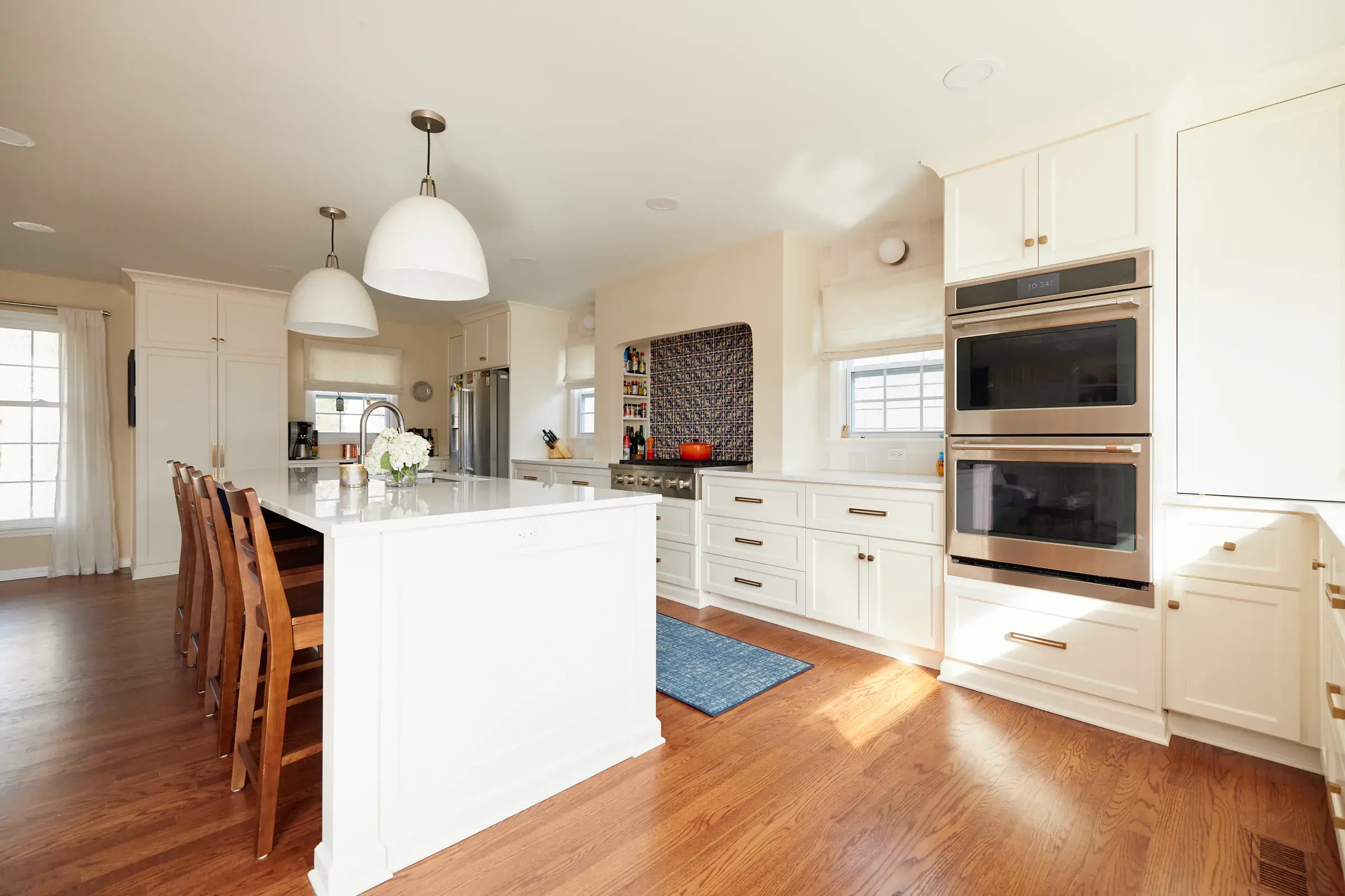 Finished hardwood floors flowing through the Guillen home kitchen